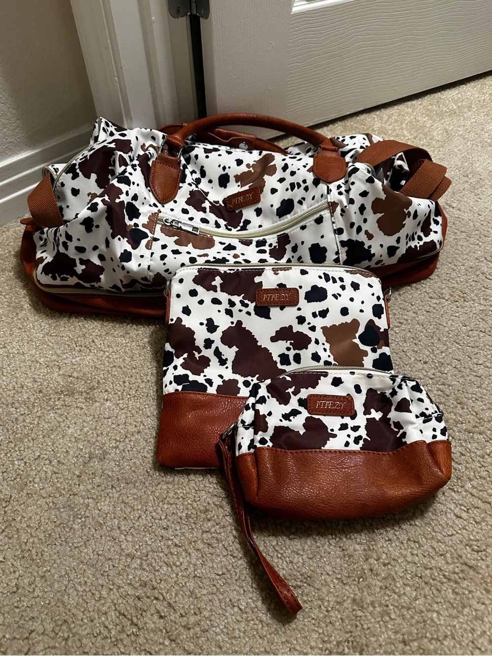 Three-Piece Cow Print Travel Bag Set with Brown Trim